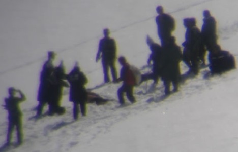 Chinese border guards burying dead body of nun in the snow 300.jpg