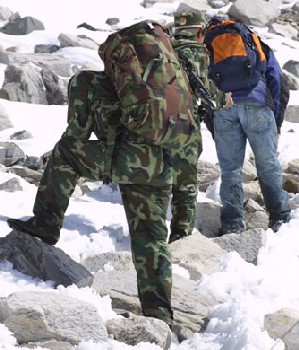 Chinese border guards leading away Tibetan refugees 350.jpg