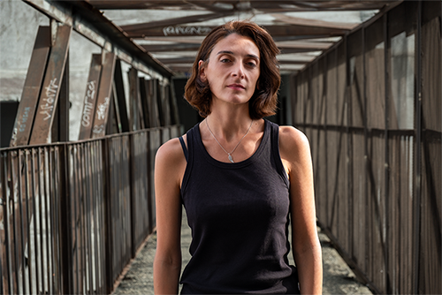 Natia Tavberidze, Human Rights House Tbilisi / Photo by Tamta Chkhaidze, at one of the bridges connecting “Shatili Buildings” in Tbilisi, Georgia, September 2024.