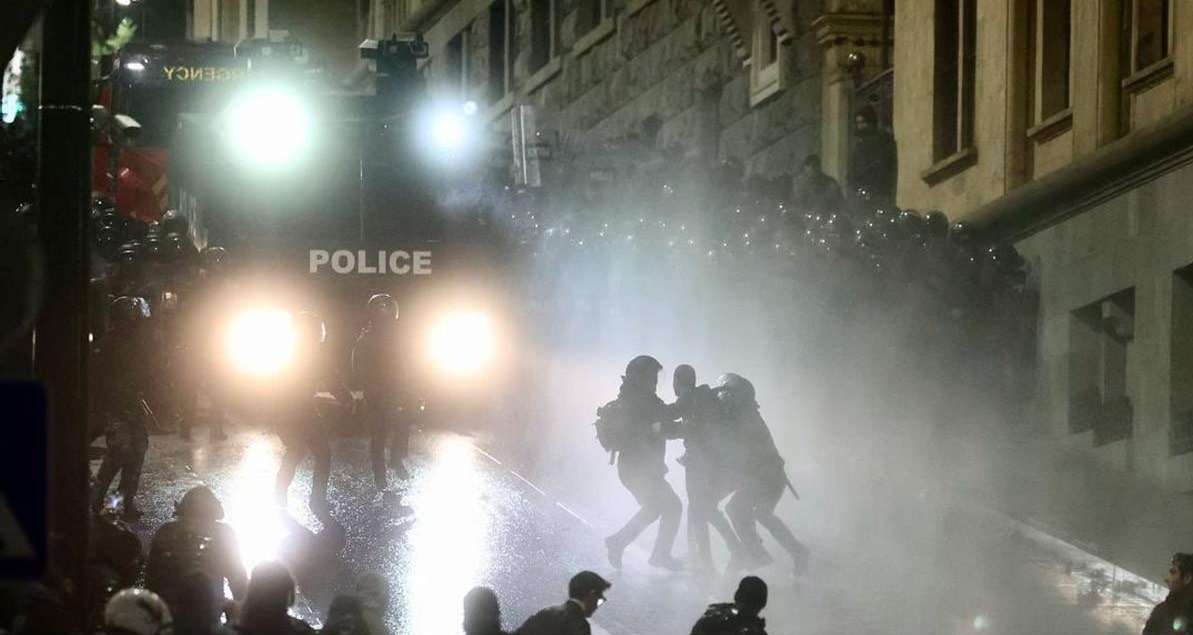 Riot police detain a person during protests in Tbilisi, December 2024.